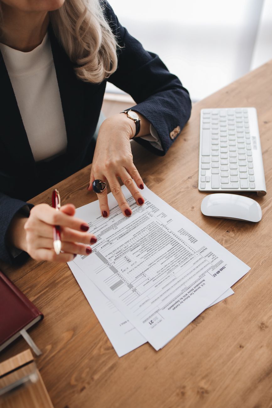 Tax documentation specialist checking spreadsheet