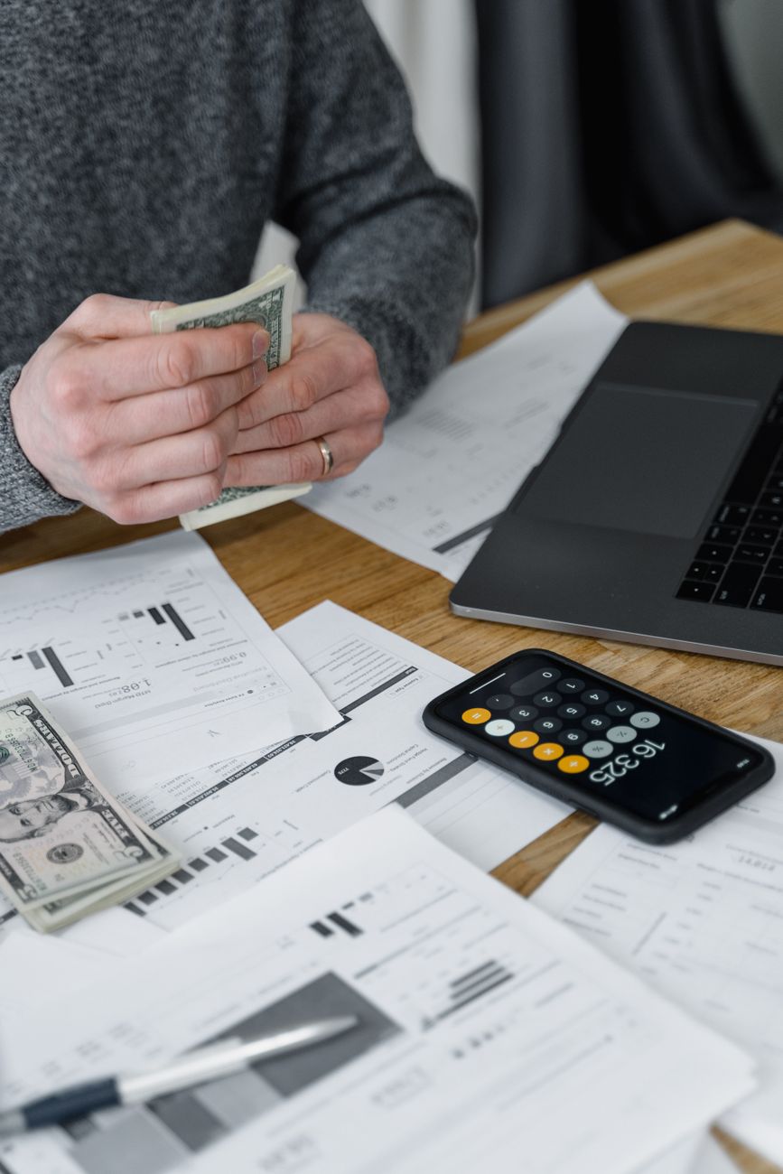 Hands reviewing receipts and accounting documents